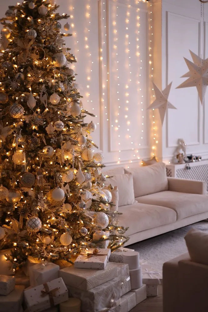 A decorated Christmas 1967 tree beside a sofa